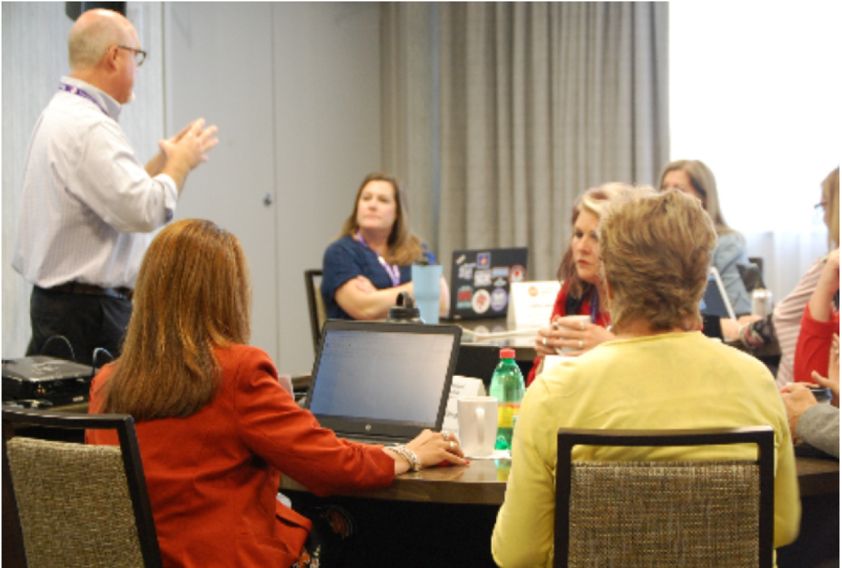 Speaker Eddie Coulson teaching group at session